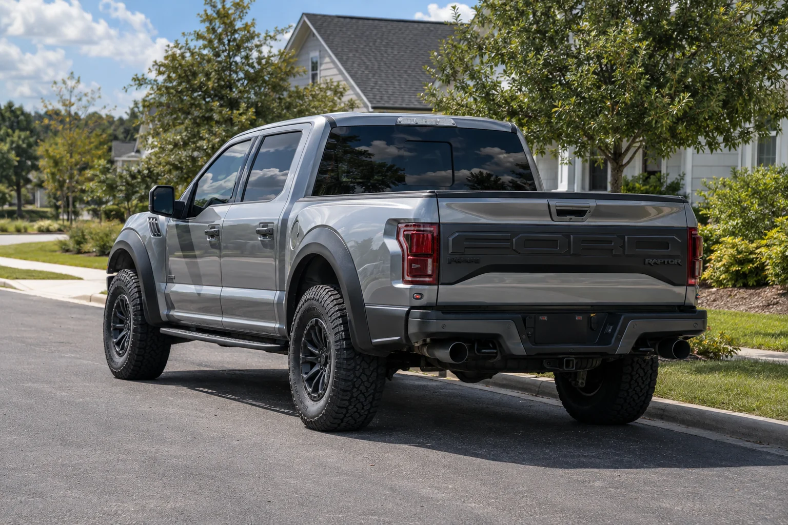 Liquid silver Ford F-150 Raptor with tinted windows