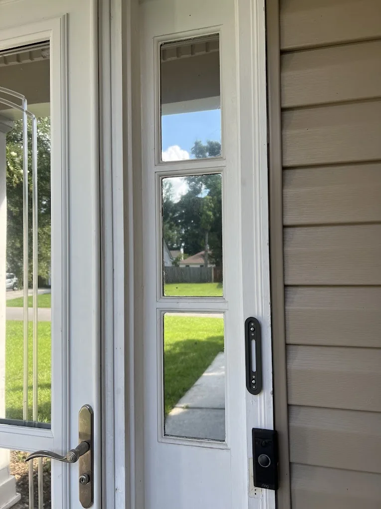 Tinted glass beside a customer’s front door