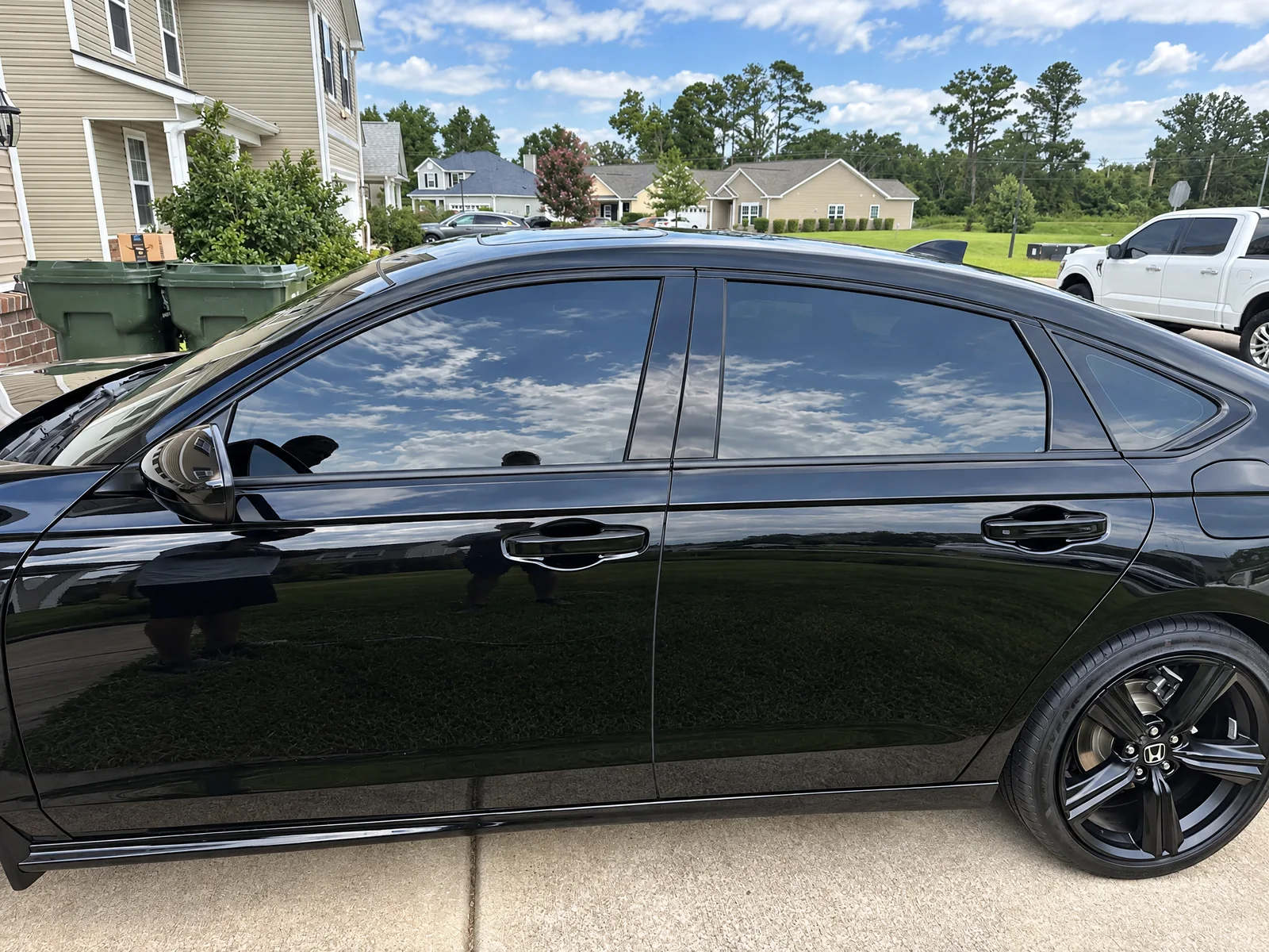 A black Honda Accord with tinted windows