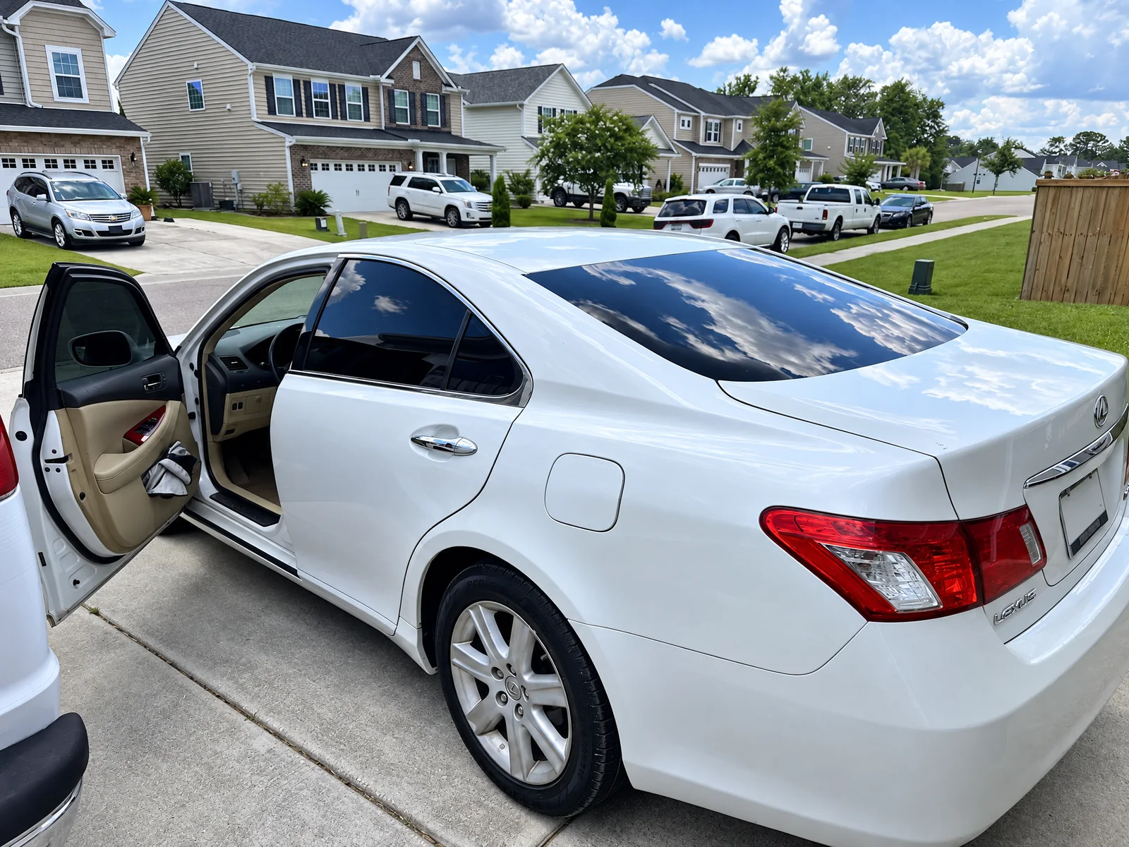 A white Lexus ES with freshly tinted windows on a customer’s driveway near Ladson, SC